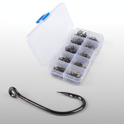 Clear plastic box with compartments containing fishing hooks, with a single fishing hook displayed in front on a black background.