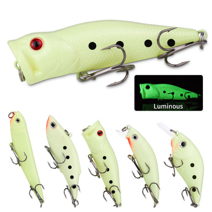 Set of glow-in-the-dark fishing lures with close-up inset showing luminous effect.