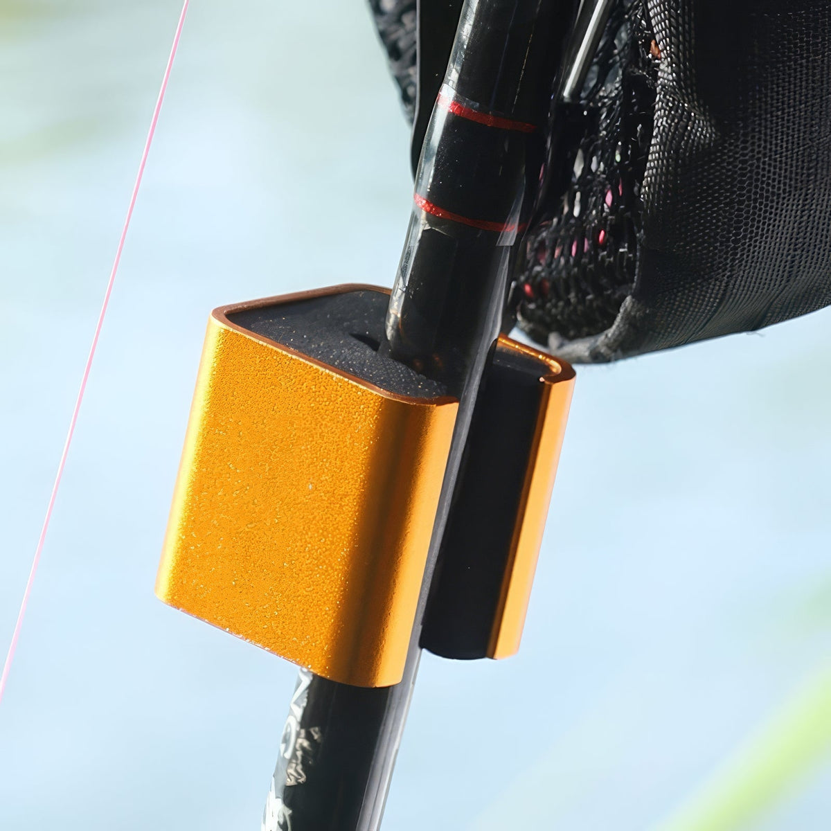 Fishing Rod Clip Holder in action by a river.
