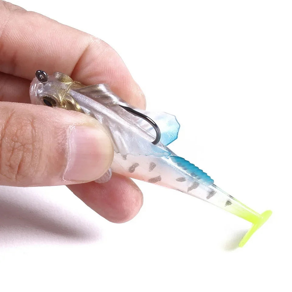 Fishing lure held between fingers against a white background